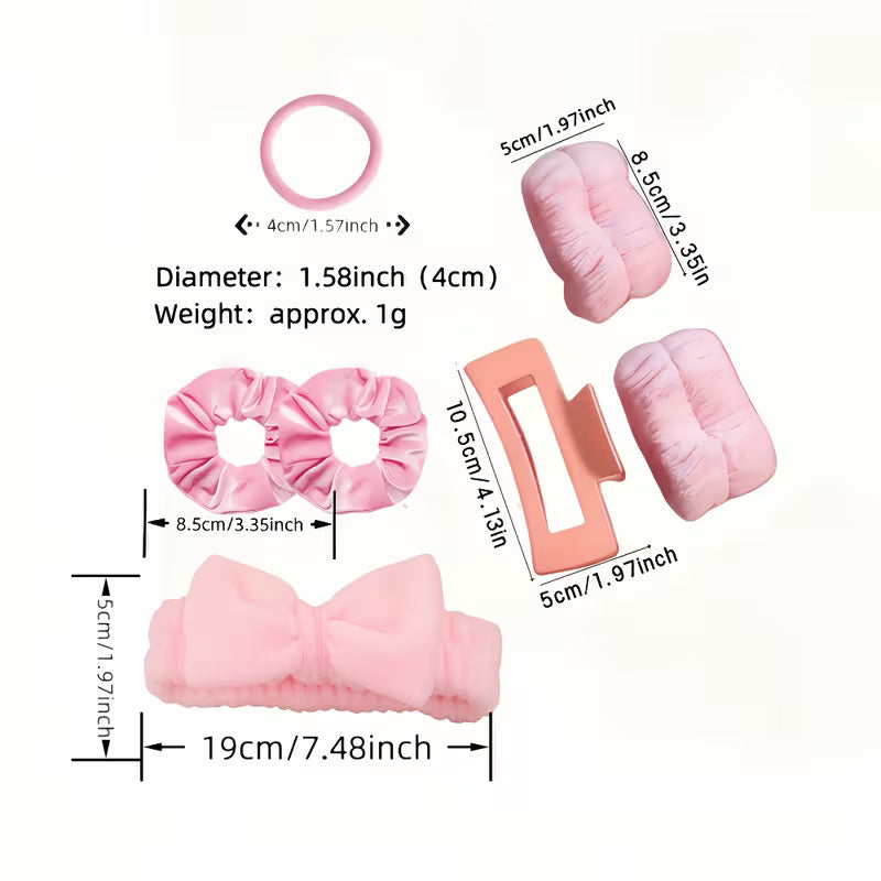 Pink spa set pieces with sizes: terry headband, two scrunchies, hair claw clip and hair ties